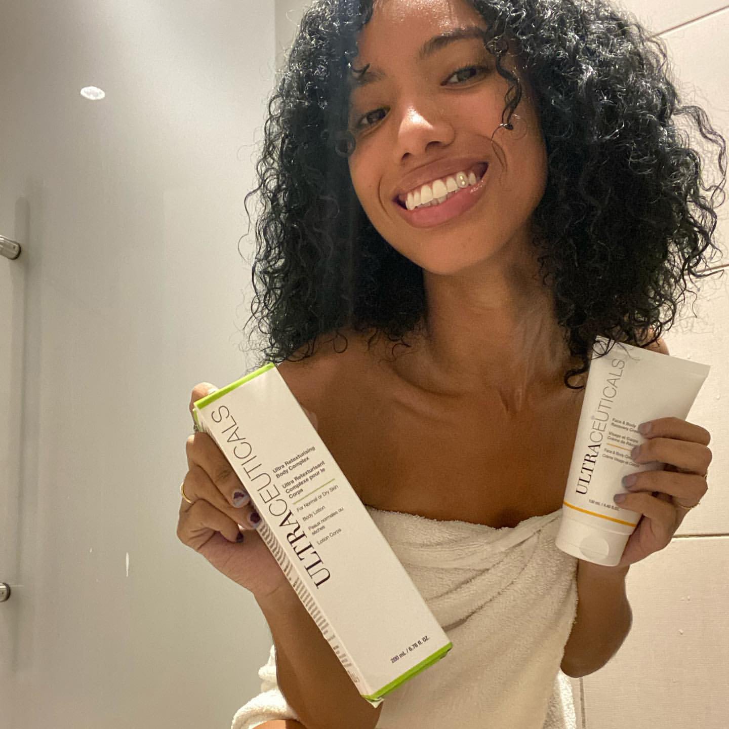 influencer holding ultraceuticals in the shower